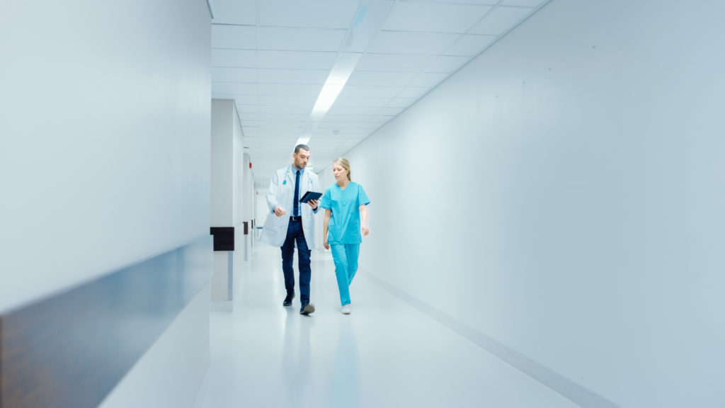 Hospital medicine staff discussing the patient assignment process