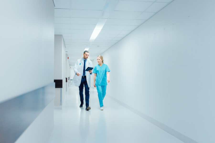 Hospital medicine staff discussing the patient assignment process