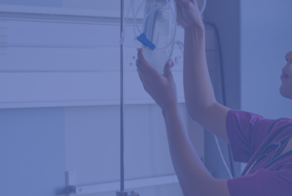 Nurse delivers infusion to a patient