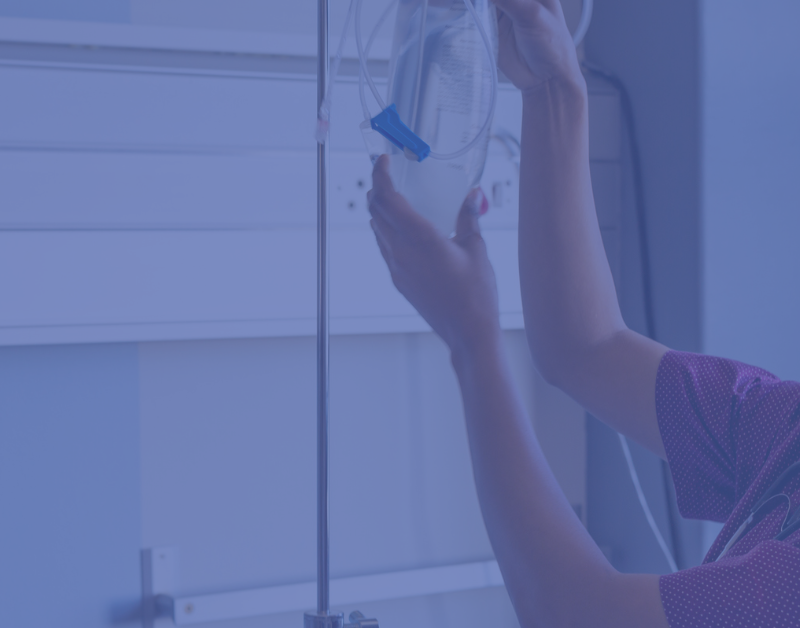 Nurse delivers infusion to a patient