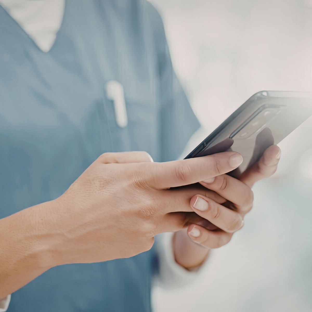 Physician entering charges on a mobile device during rounding